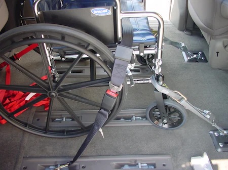 Manual wheelchair tie-down straps