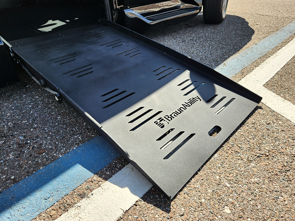 Power ramp for wheelchair accessible van